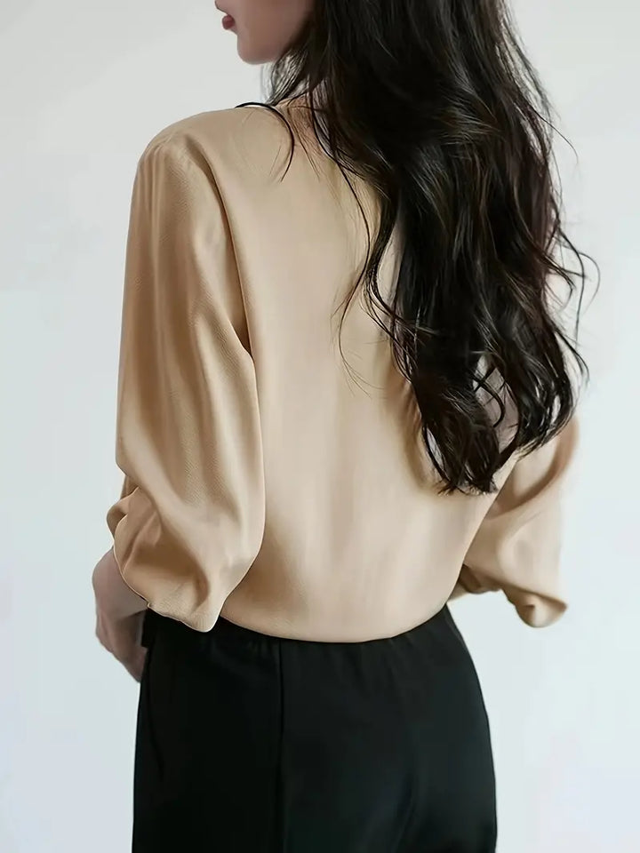 Blouse with Asymmetrical Button Design and Soft Flowy Drape in Lightweight White Fabric