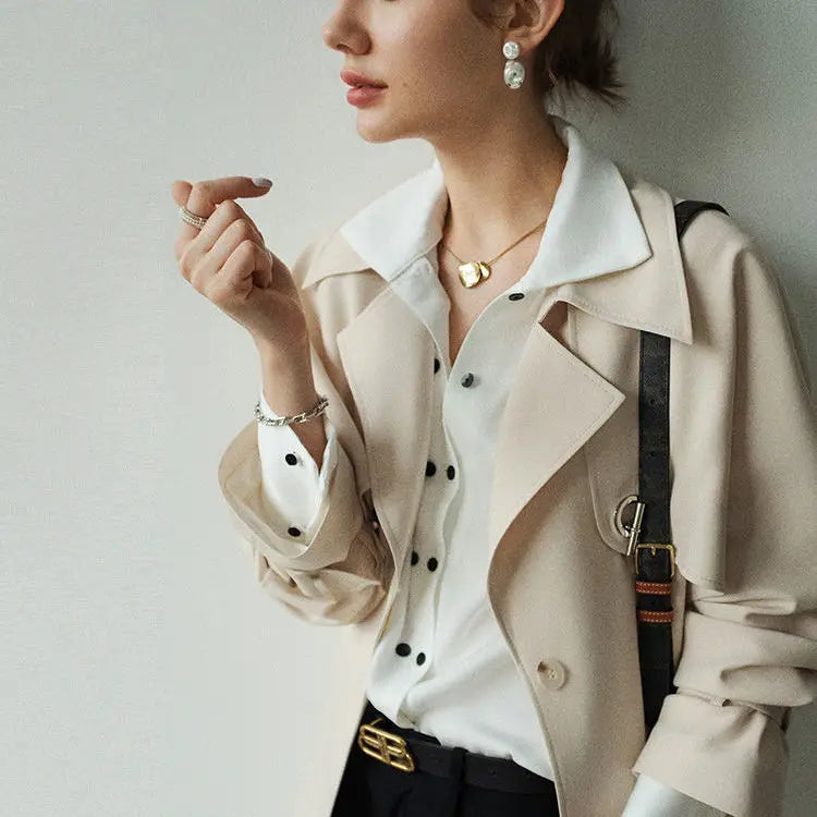 Blouse with Asymmetrical Button Design and Soft Flowy Drape in Lightweight White Fabric