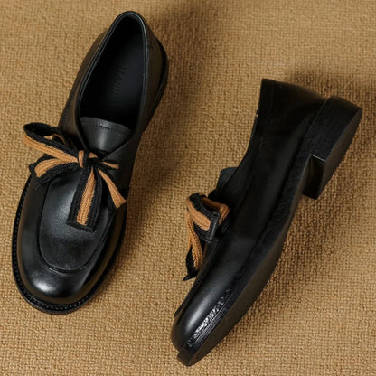 Two-Tone Leather Loafers with Woven Lace Detail and Cushioned Comfort Sole