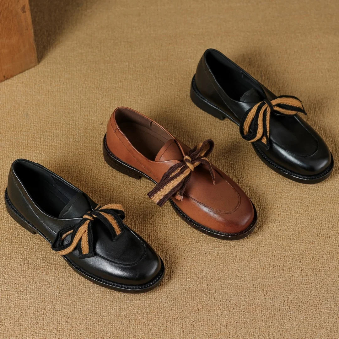 Two-Tone Leather Loafers with Woven Lace Detail and Cushioned Comfort Sole