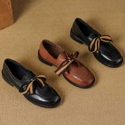 Two-Tone Leather Loafers with Woven Lace Detail and Cushioned Comfort Sole