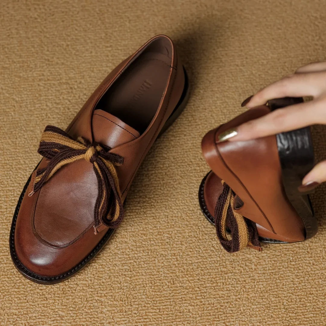 Two-Tone Leather Loafers with Woven Lace Detail and Cushioned Comfort Sole