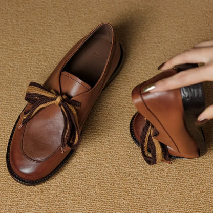 Two-Tone Leather Loafers with Woven Lace Detail and Cushioned Comfort Sole