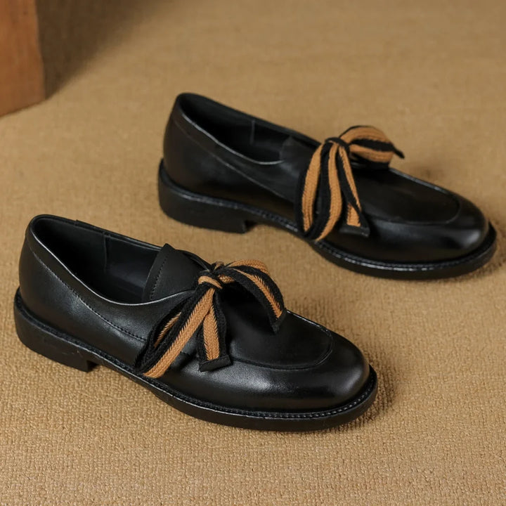 Two-Tone Leather Loafers with Woven Lace Detail and Cushioned Comfort Sole